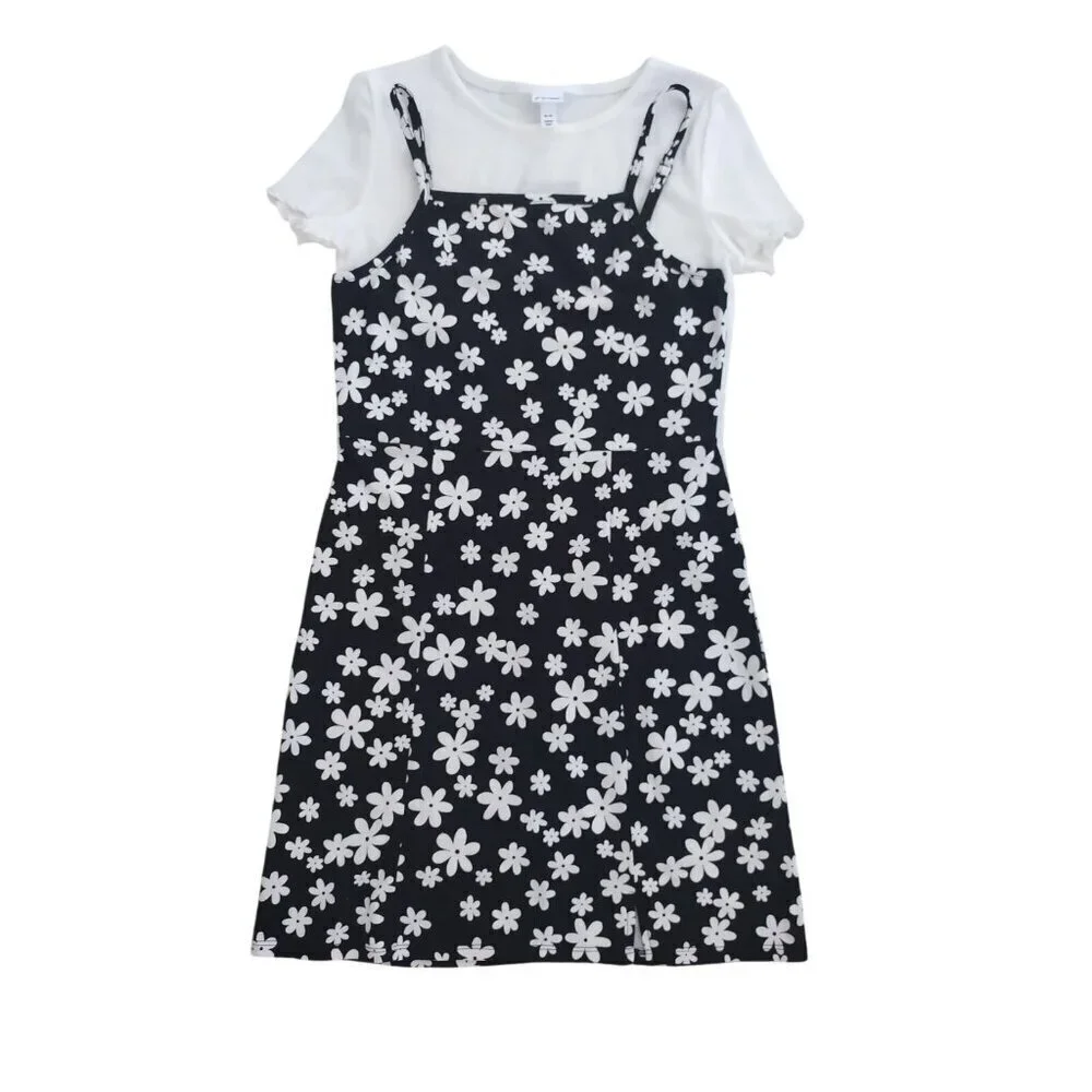 art class. Girls black and white floral print dress and white shirt sleeve. NWT